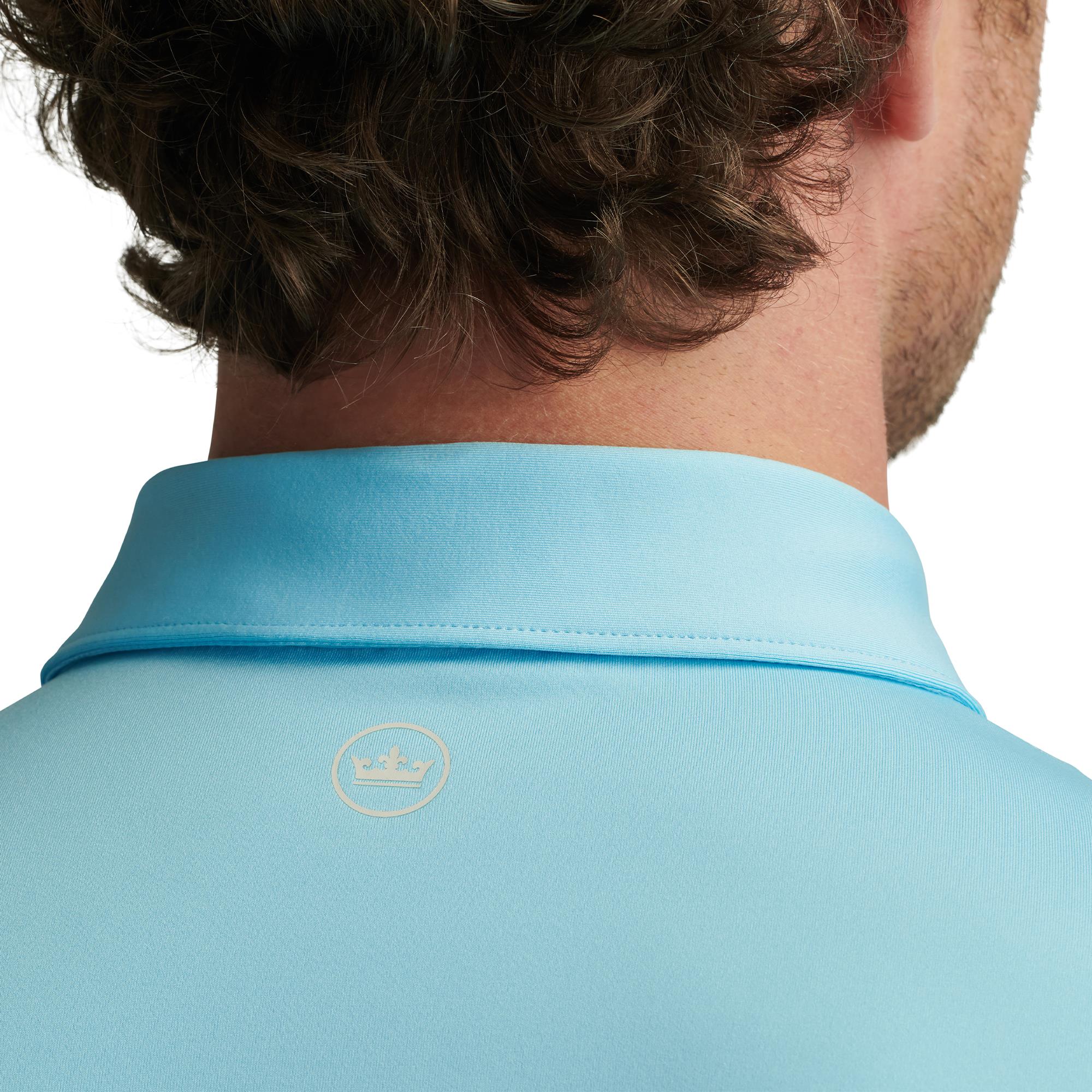 Close-up of back collar and Peter Millar logo on Solid Polo Shirt in Maya Blue – designer mens golf polo UK